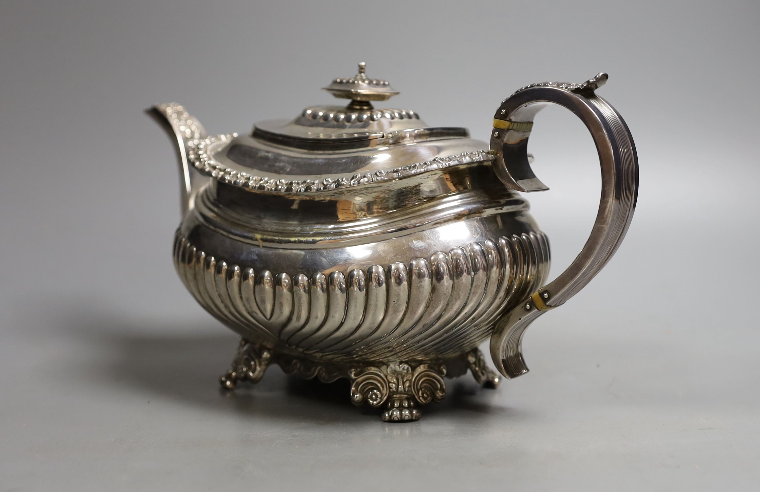 A George IV demi-fluted silver teapot, by John & Thomas Settle, Sheffield, 1824, gross weight 23.5oz (patch to base).